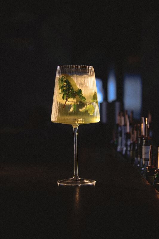 Hugo spritz with mint in a stemmed glass
