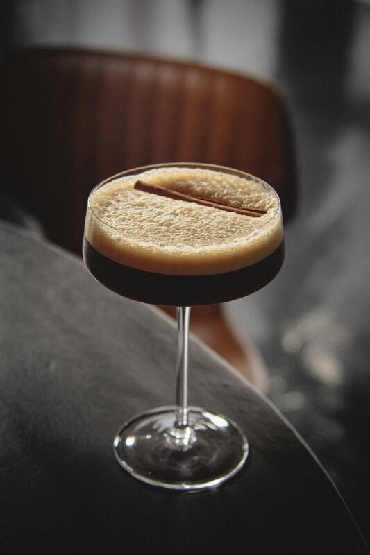 Espresso martini with a cinnamon stick