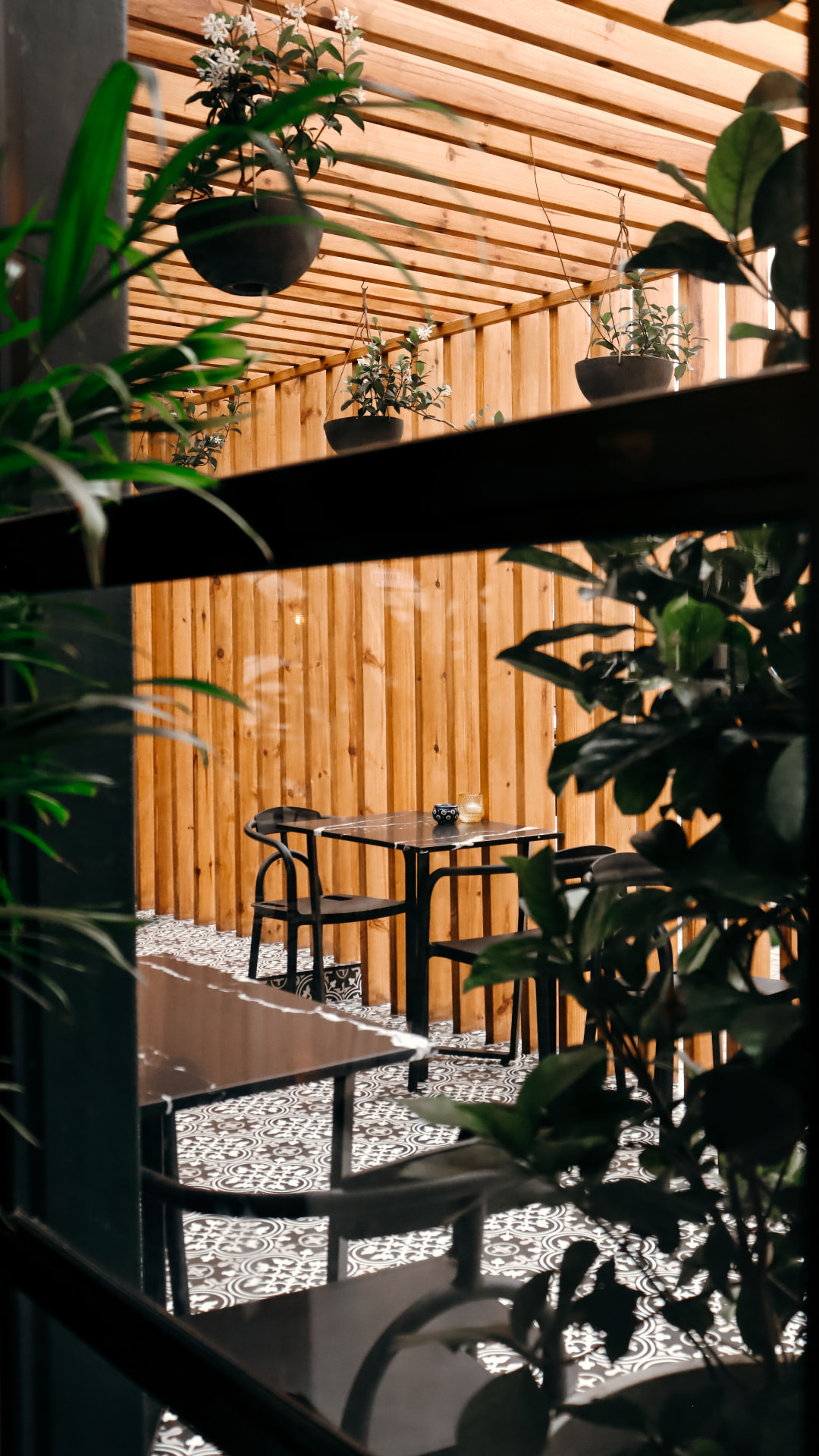 The courtyard seating with hanging jasmine and patterned tiles