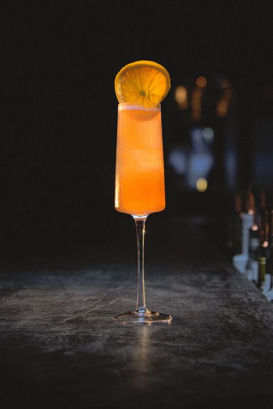 Sparkling orange cocktail in a flute